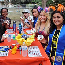Photo of UCRiverside's Guardian Scholars celebrating at a party for the program's 10th anniversary in October 2018.